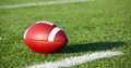 Image of a football on a yard line